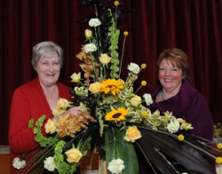 Pictured at one of the many floral displays at the flower festival in St Mark's Church, Ballymacash are Ballymacash Flower Club founder members Kaye Sommerville (left) and Joan Lockhart (right).